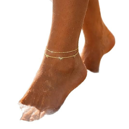 Women's anklet with filigree bow design and elegant chain play Nin Boutique