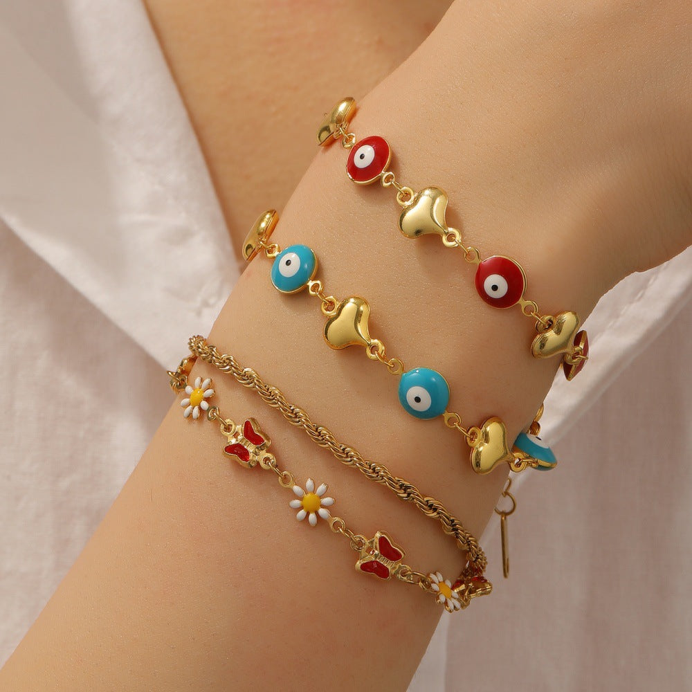 Ladies bracelet with elaborate pendants Nin Boutique