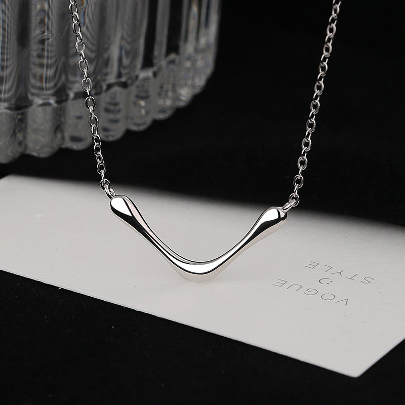 Women's necklace with modern, curved pendant Nin Boutique