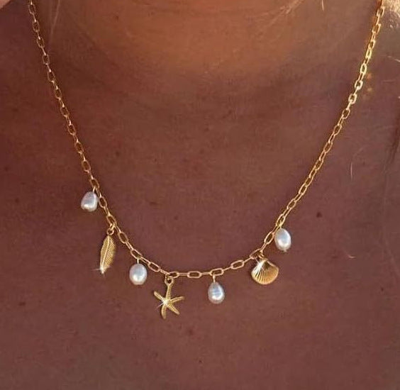 Women's necklace in maritime style with shells and pearl pendants Nin Boutique