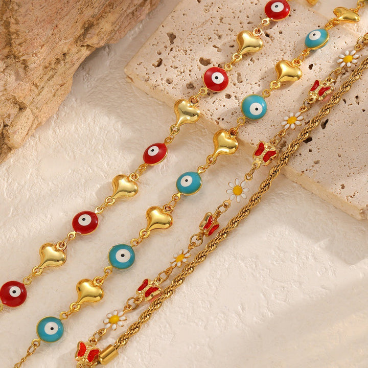 Ladies bracelet with elaborate pendants Nin Boutique