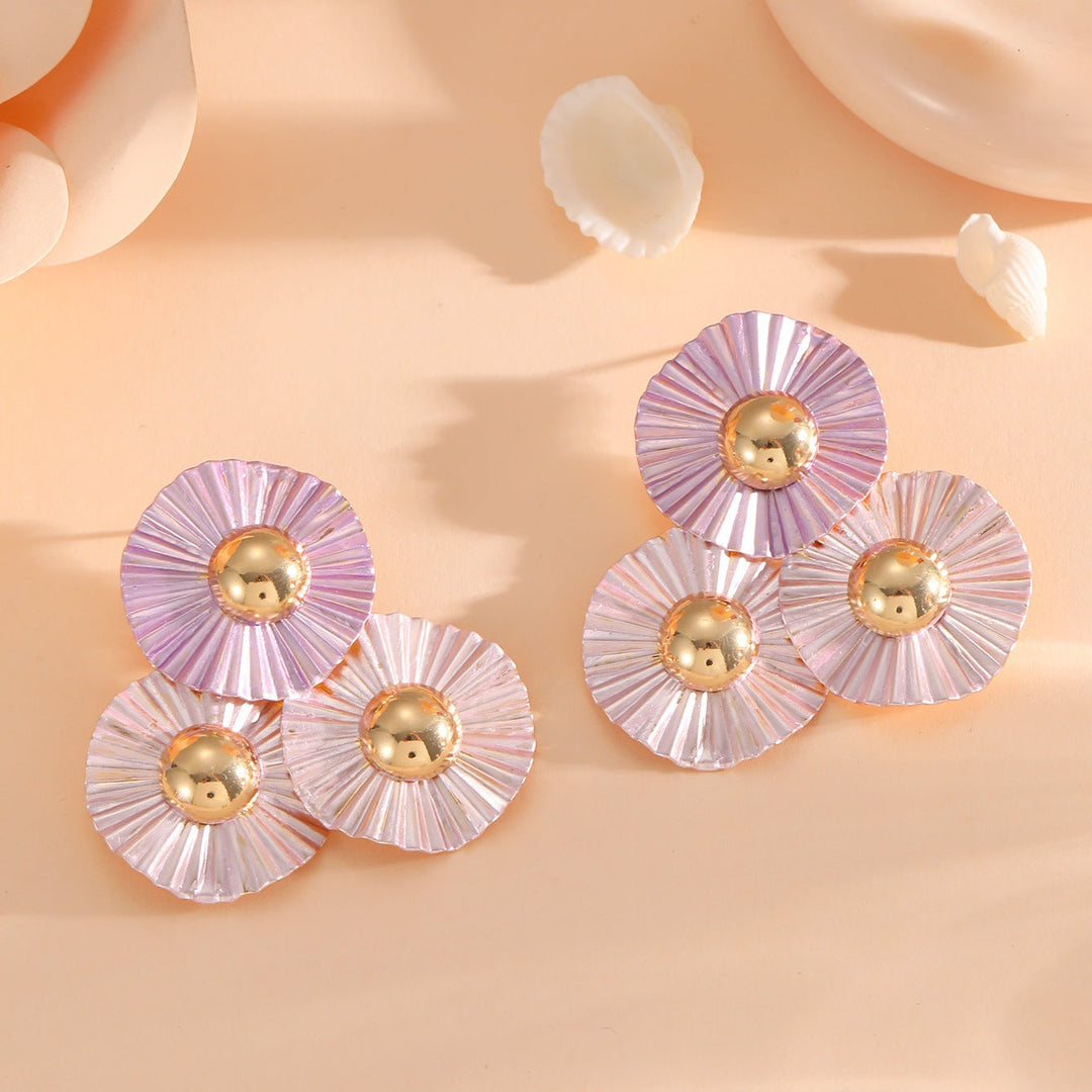 Ladies earrings with intricate fold design and shimmering accents Nin Boutique