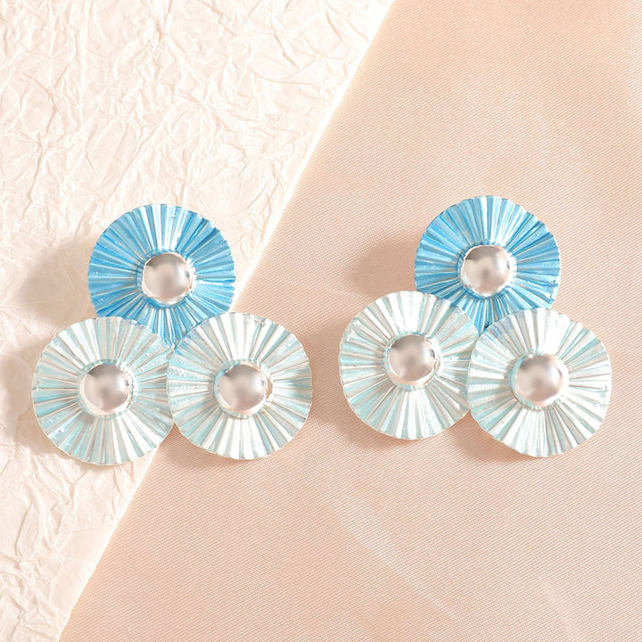 Ladies earrings with intricate fold design and shimmering accents Nin Boutique