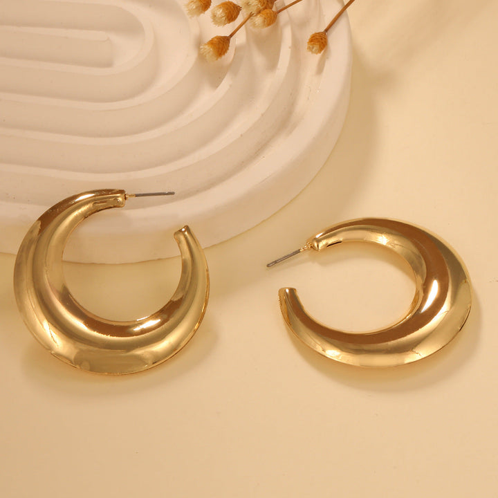 Ladies earrings in elegant wave pattern Nin Boutique