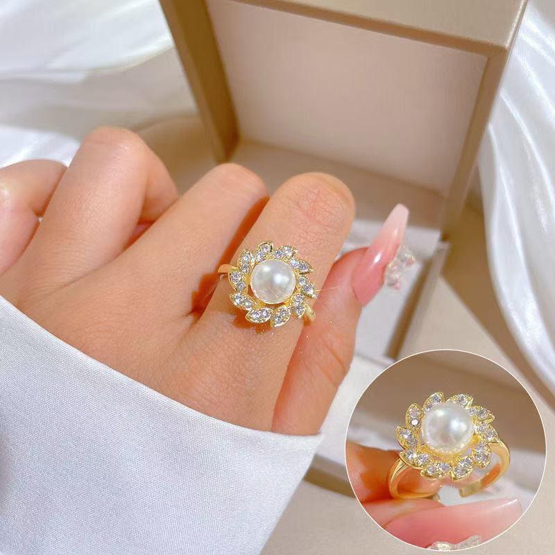 Women's luxury pearl halo cocktail ring with cubic zirconia petal accents and adjustable band Nin Boutique