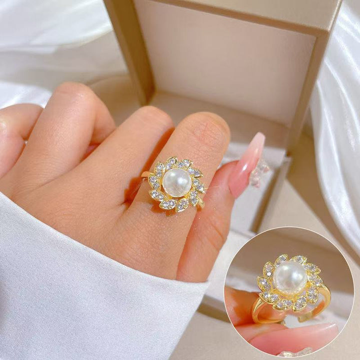 Women's luxury pearl halo cocktail ring with cubic zirconia petal accents and adjustable band Nin Boutique