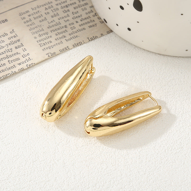 Women's earrings with elegant, curved design Nin Boutique