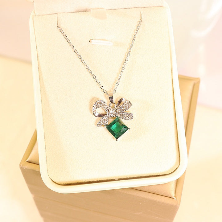 Women's vintage bow cocktail ring with square-cut gemstone simulant and pavé crystal accents Nin Boutique