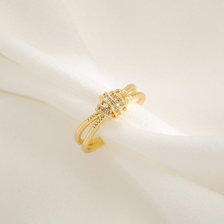 Ladies ring with elaborate, multi-layered design and zirconia appliqués Nin Boutique