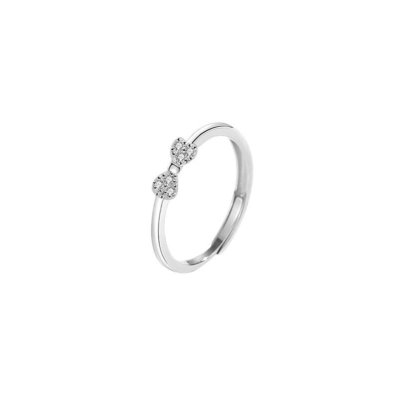 Women's ring with intricate bow motif and sparkling zirconia by Nin Boutique