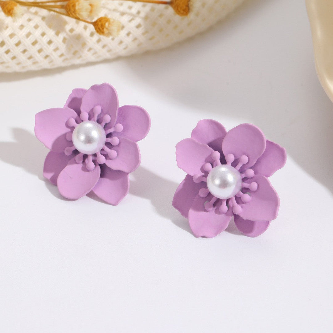 Women’s earrings with artistic floral motif and pearl accent Nin Boutique