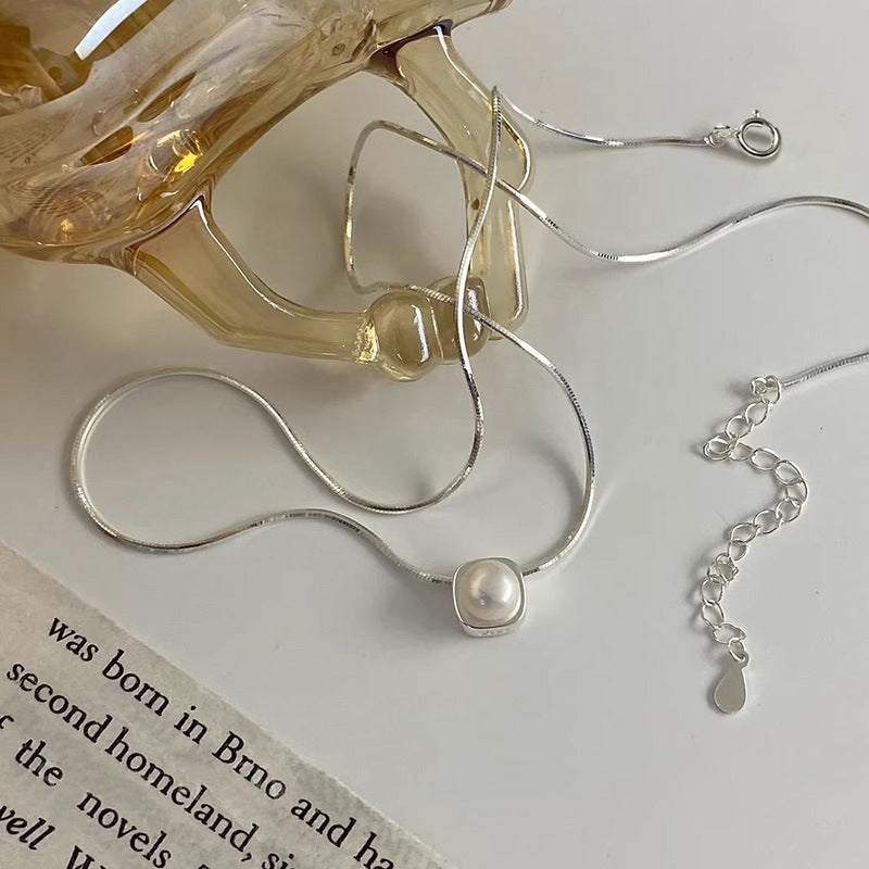 Women's necklace with timeless pearl pendant and elegant silver minimalism Nin Boutique