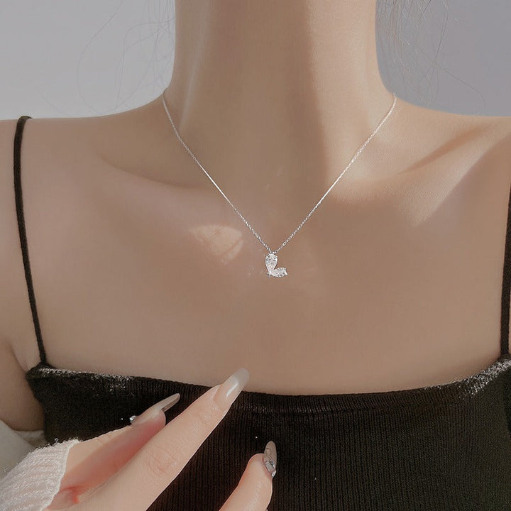Ladies necklace with filigree butterfly pendant and sparkling zirconia Nin Boutique