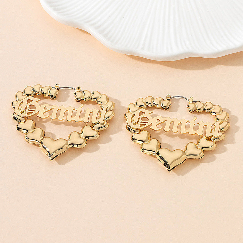 Women’s earrings with unique heart design and astrological element Nin Boutique