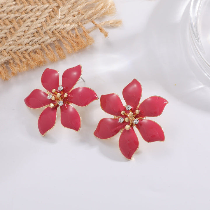 Women's earrings with intricate floral pattern and sparkling accents Nin Boutique