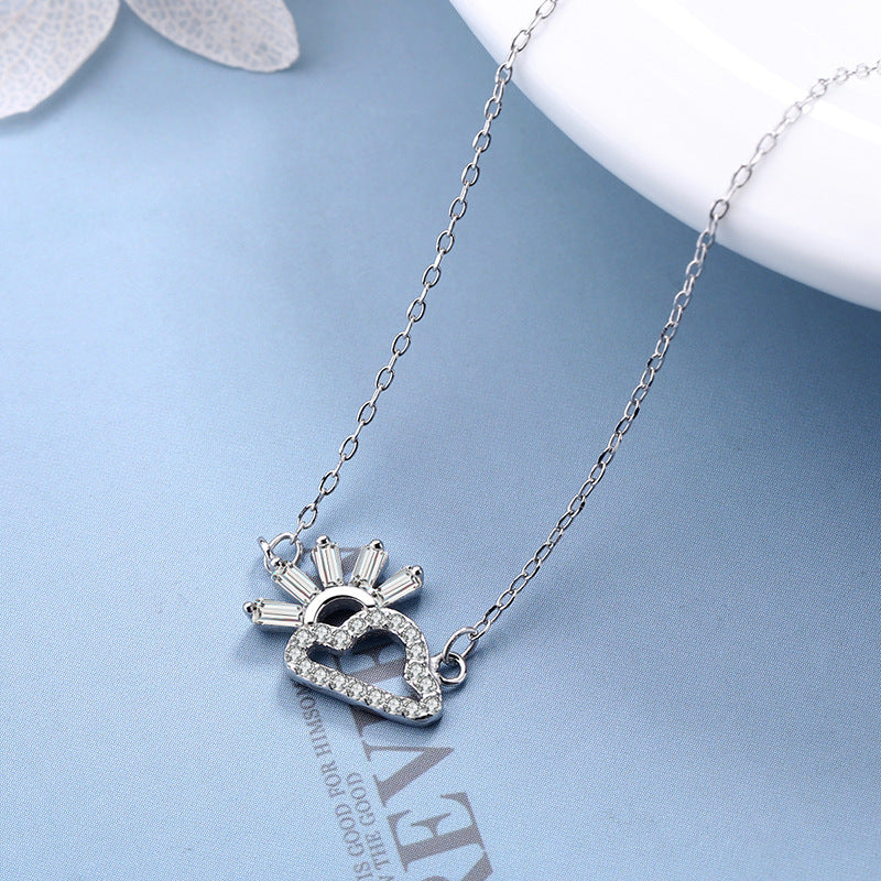 Ladies necklace in artistic cloud and sun design with sparkling zirconia from Nin Boutique