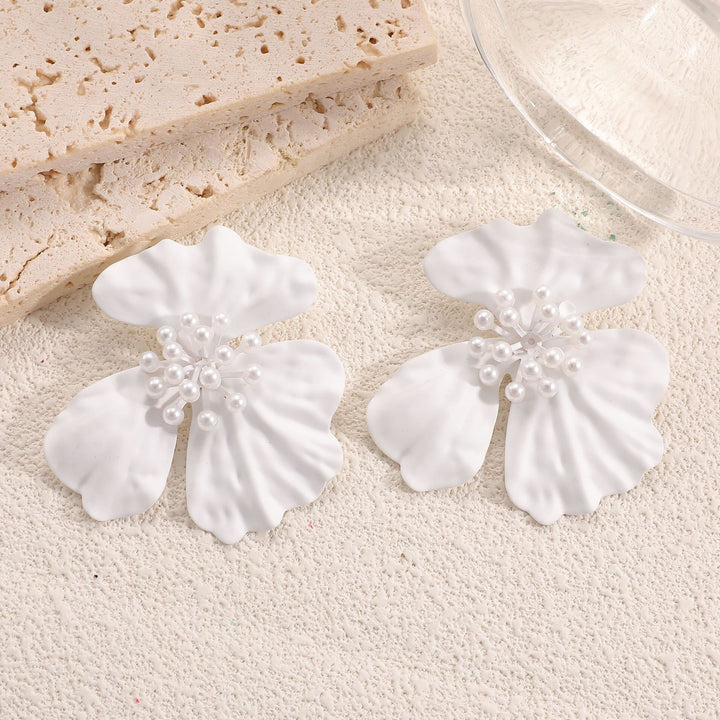 Ladies earrings with playful floral motif and pearl accent Nin Boutique