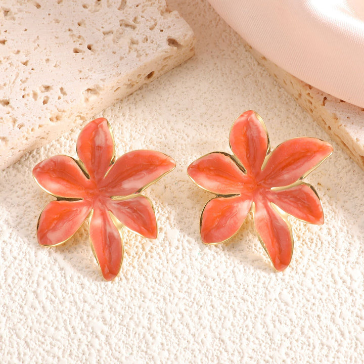 Ladies earrings with floral design and elegant gold rim Nin Boutique