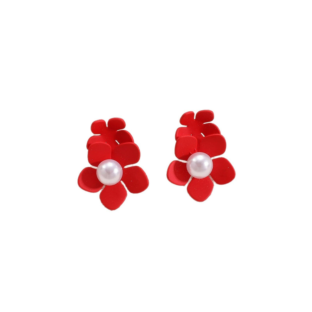 Ladies earrings with playful floral motif and pearl accent Nin Boutique