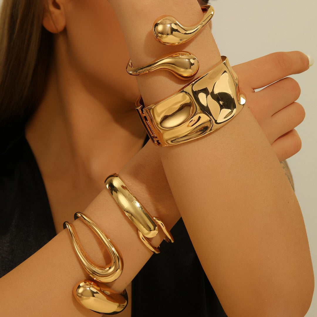 Women's arm cuff in modern, sculptural gold design Nin Boutique