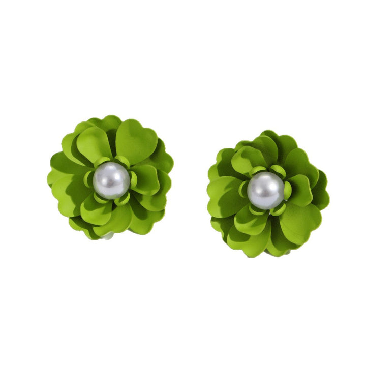 Ladies earrings with elaborate floral designs and pearl accents Nin Boutique