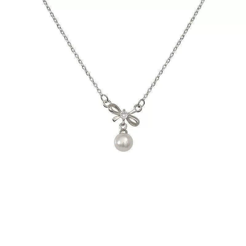Women's necklace with elegant bow and pearl decoration Nin Boutique