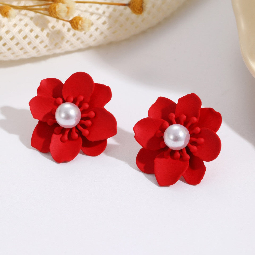 Women’s earrings with artistic floral motif and pearl accent Nin Boutique