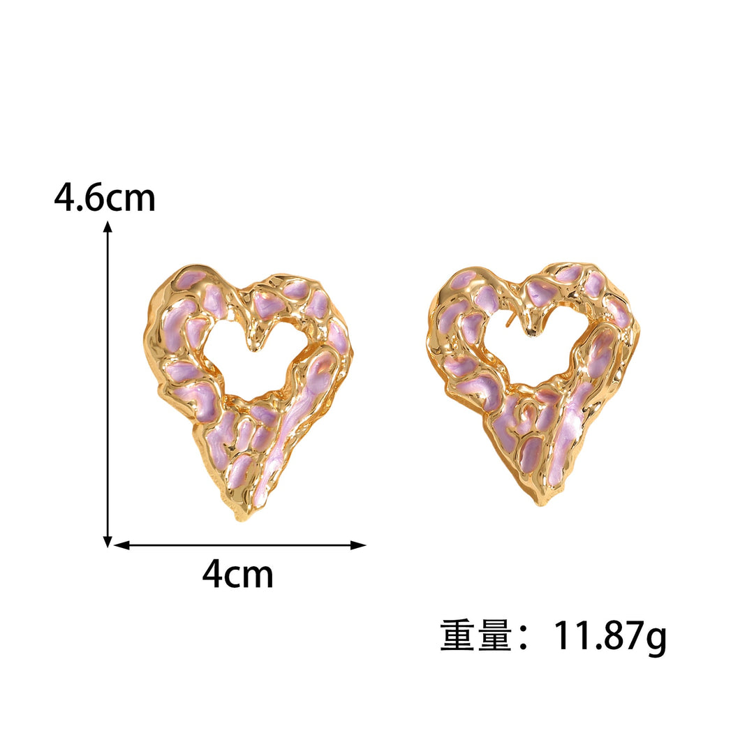 Women’s earrings with unique heart-shaped design and shimmering surface Nin Boutique