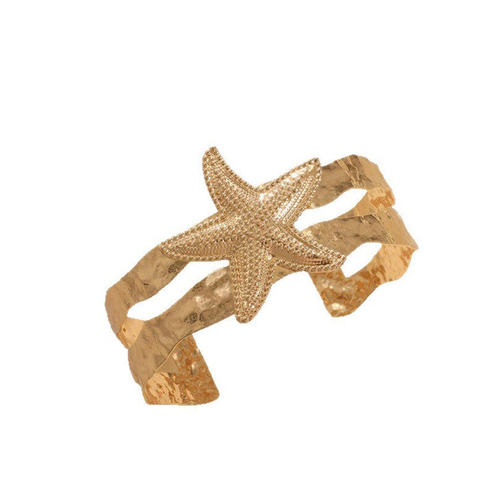 Women’s bracelet with intricate shell and starfish design Nin Boutique