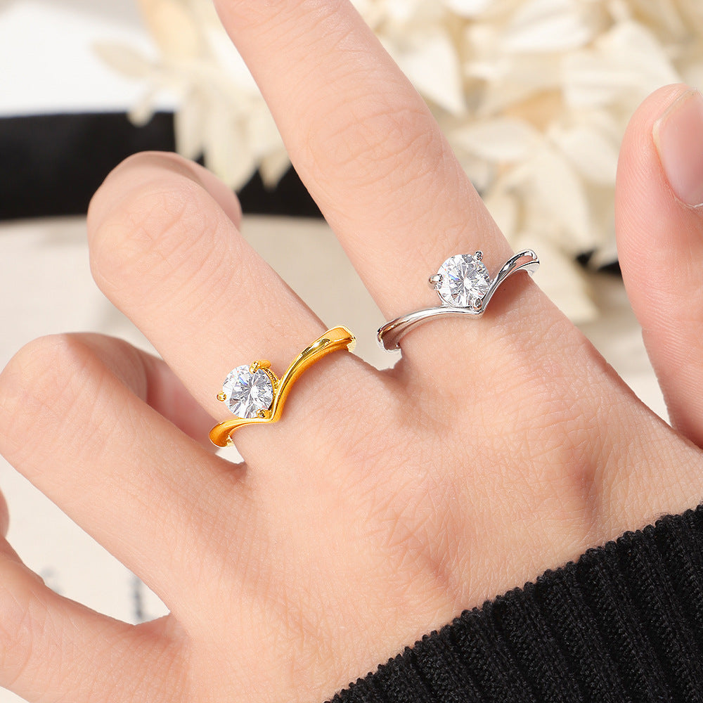 Ladies ring with elegant wave pattern and sparkling zirconia Nin Boutique