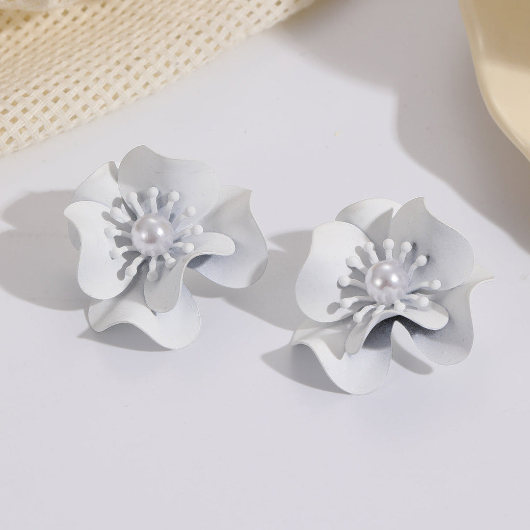 Women's earrings with intricate floral design and pearl accent Nin Boutique