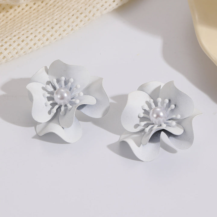 Women's earrings with intricate floral design and pearl accent Nin Boutique