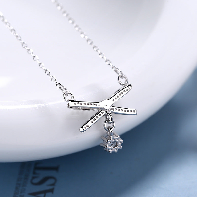 Women's necklace with artistic X design and sparkling pendant Nin Boutique